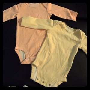2 long sleeve Carter's onesies.